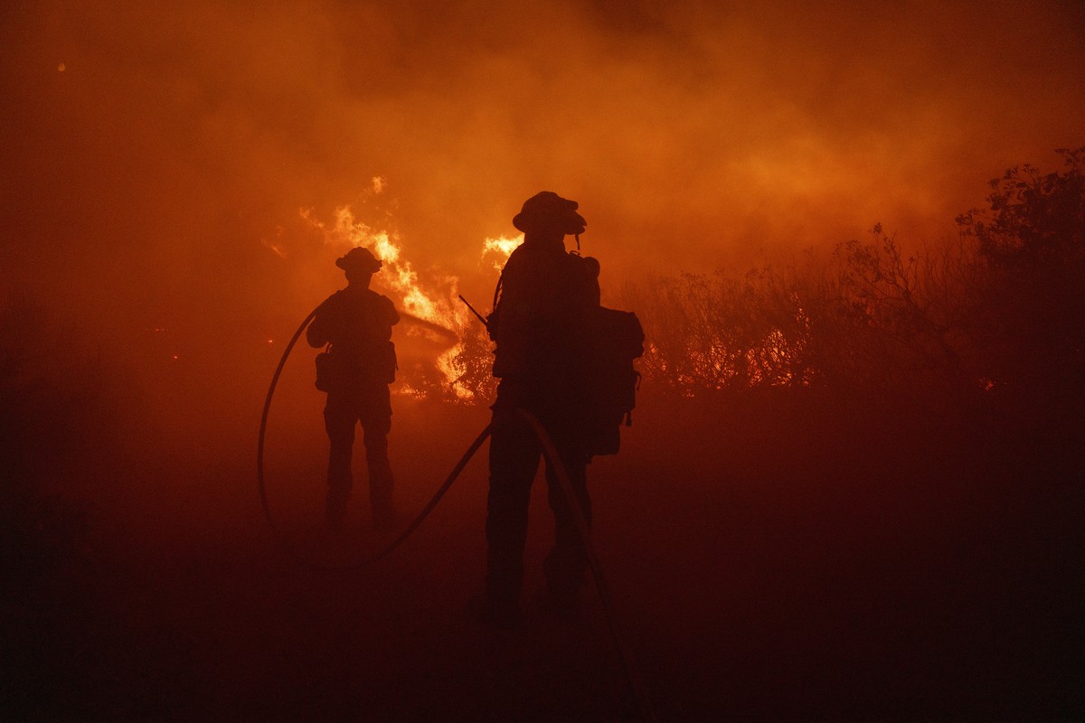 Firefighters work against the advancing Post Fire early Saturday, June 16, 2024, in Gorman, Calif. (AP Photo/Eric Thayer)