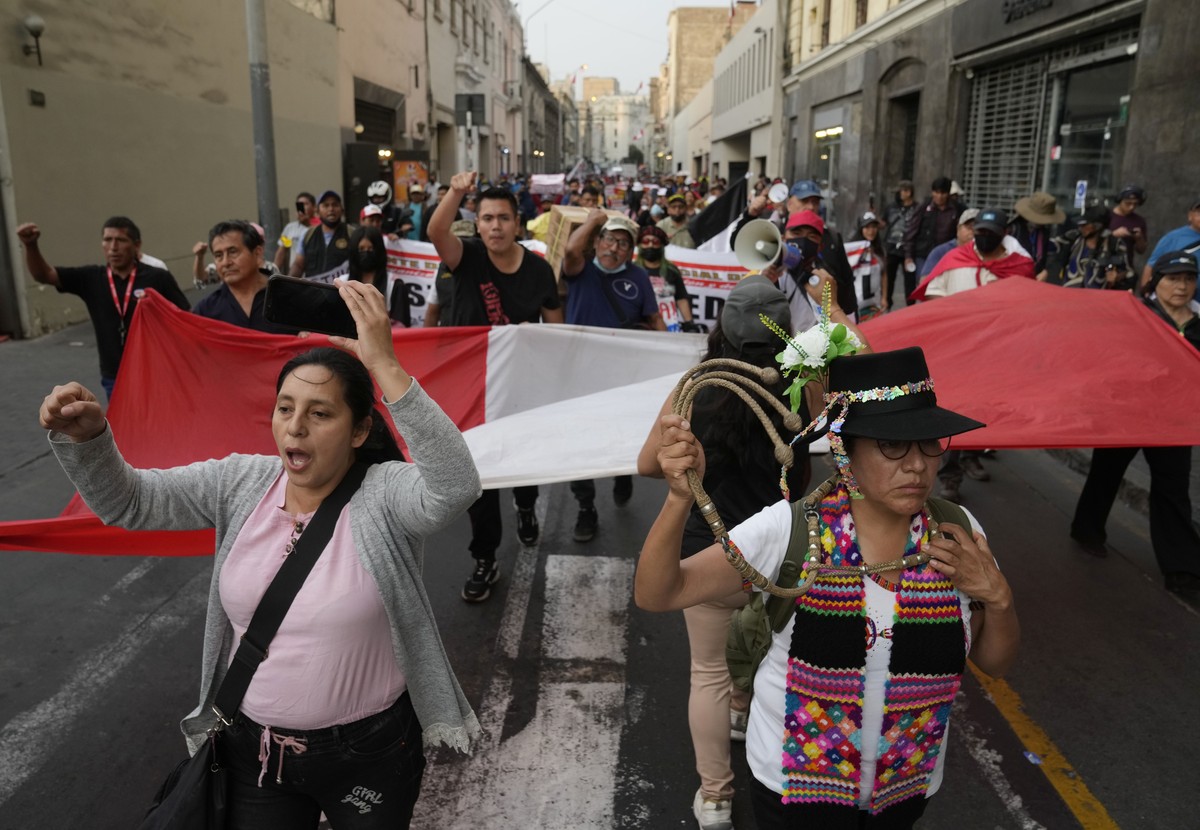 Supporters of former President Pedro Castillo march in Lima, Peru, Tuesday, Dec. 20, 2022. Peru's Congress tentatively endorsed a plan on Tuesday to hold early elections in an attempt to defuse a ...