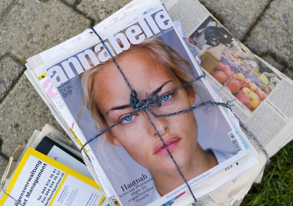 Bundles of scrap paper with an edition of the Swiss fashion magazine &quot;Annabelle&quot; on top featuring Swiss model Nadine Strittmatter on its cover, pictured on October 21, 2008 in Zurich, Switze ...