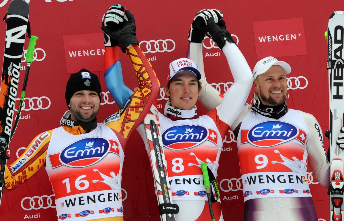 Winner Carlo Janka of Switzerland, is flanked by second placed Manuel Osborne-Paradis of Canada (left) and 3rd placed Marco Buechel of Liechtenstein,(right) on the podium after the men's ski Wolr ...
