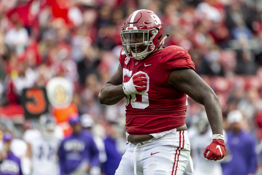 FILE - Alabama defensive lineman Christian Barmore (58) celebrates a sack against Western Carolina during the first half of an NCAA college football game in Tuscaloosa, Ala., in this Saturday, Nov. 23 ...