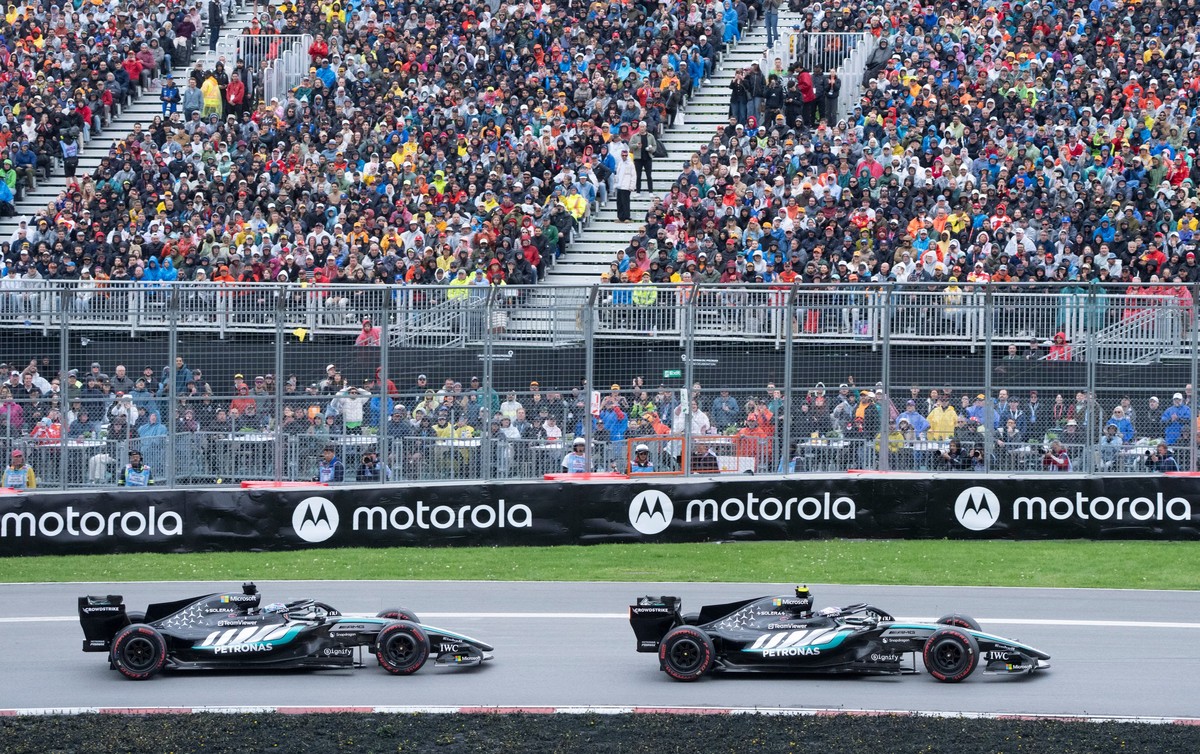 Mercedes driver Kimi Antonelli, right, of Italy, leads teammate Mercedes driver George Russell, of Britain, during the F1 Canadian Grand Prix auto race in Montreal, Sunday, May 24, 2026. (Christinne M ...