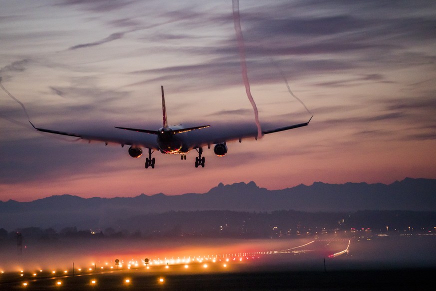 An Airbus A330 from Swiss International Airlines lands on a foggy morning at Zurich Airport, on Friday, October 13, 2017, in Zurich, Switzerland. The high humidity renders the air vortex visible. (KEY ...