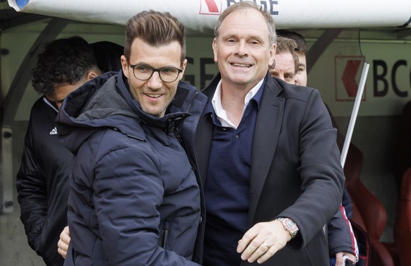 Alain Geiger, right, coach of Servette FC, welcomes, Raphael Wicky, coach of BCS Young Boys, prior the Super League soccer match of Swiss Championship between Servette FC and BSC Young Boys, at the St ...