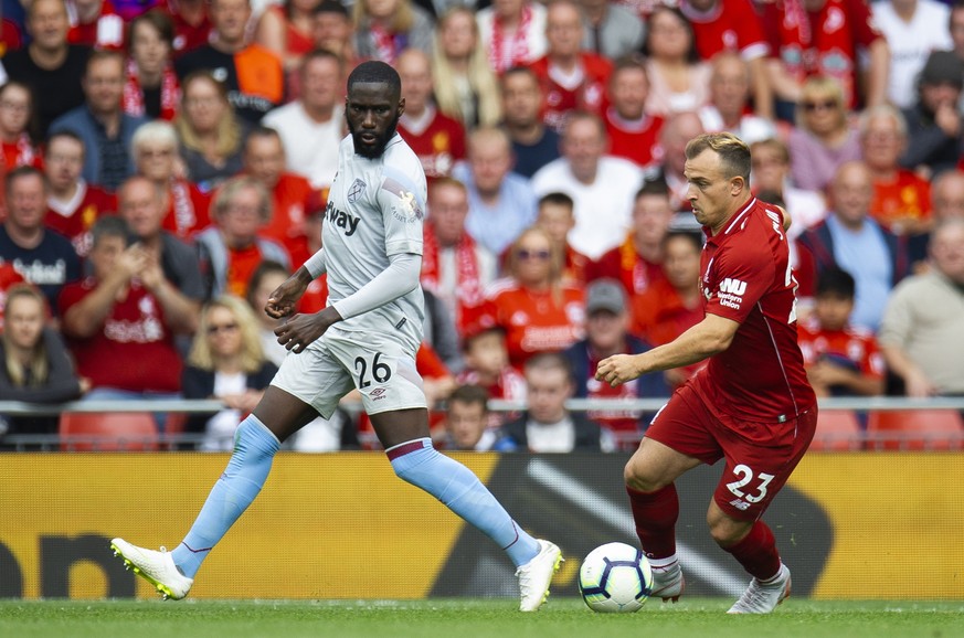 epa06945854 West Ham United&#039;s Arthur Masuaku (L) in action with Liverpool&#039;s Xherdan Shaqiri (R) during the English Premier League soccer match between Liverpool and West Ham at the Anfield i ...