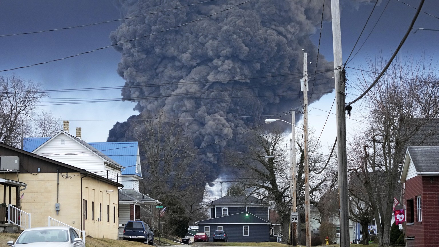 A large plume of smoke rises over East Palestine, Ohio, after a controlled detonation of a portion of the derailed Norfolk Southern trains Monday, Feb. 6, 2023. About 50 cars, including 10 carrying ha ...