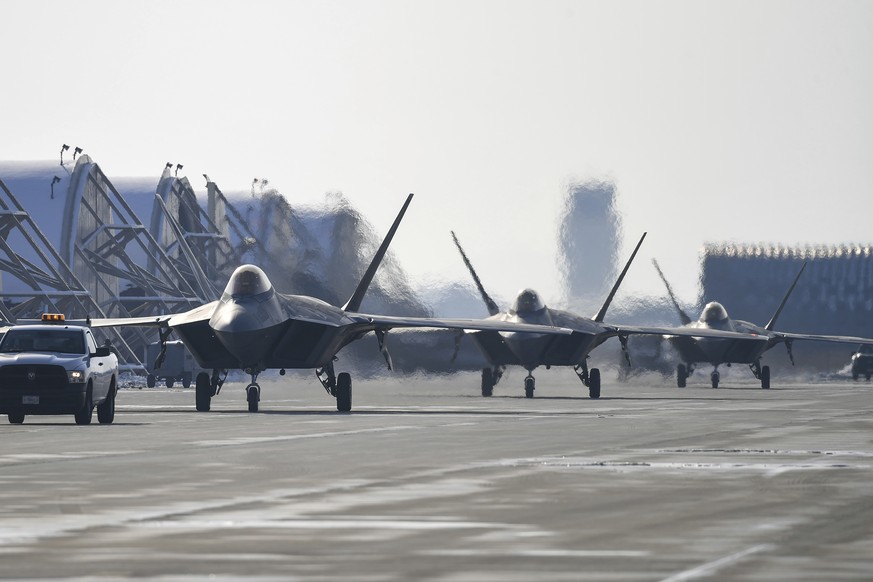 In this photo provided by South Korean Defense Ministry, U.S. F-22 fighter jets taxi after landing during the joint air drills with South Korea in Gunsan, South Korea, Tuesday, Dec. 20, 2022. The Unit ...