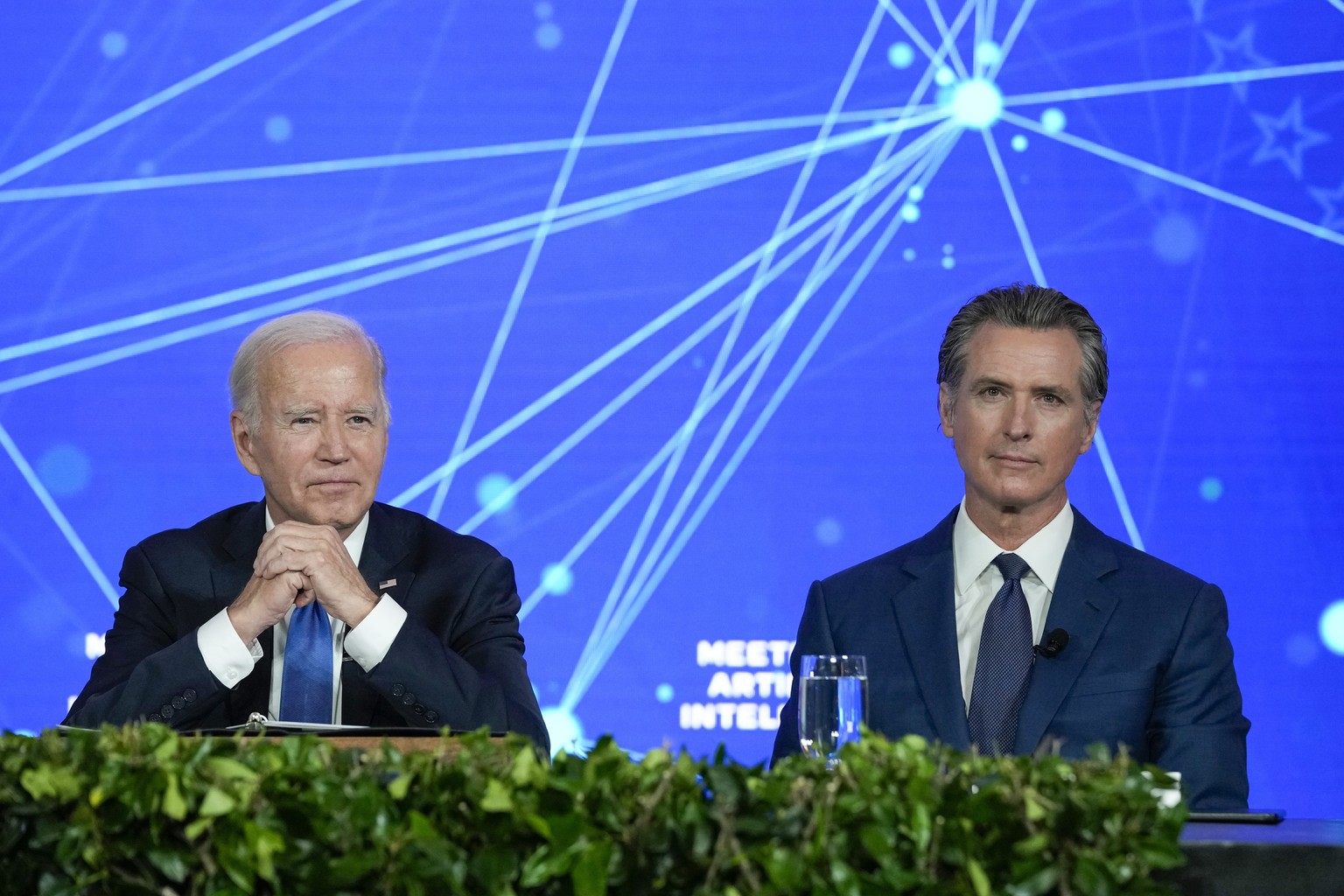 FILE - President Joe Biden and California Gov. Gavin Newsom wait for reporters to leave the room during a discussion on managing the risks of Artificial Intelligence during an event in San Francisco,  ...