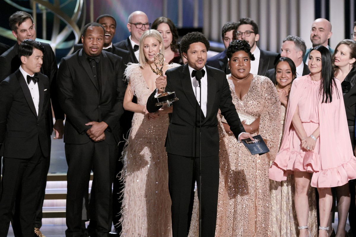 epa11081044 South African comedian Trevor Noah reacts with cast and crew after winning best talk series for 'The Daily Show with Trevor Noah' during the 75th annual Primetime Emmy Awards cer ...