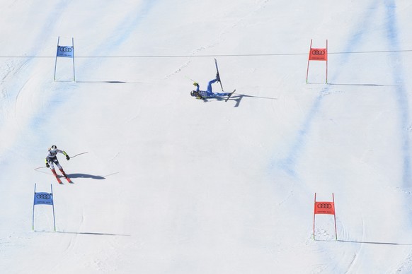 epa09018674 Lara Della Mea of Italy (R) crashes during her race against Erika Pykalainen of Finland (L) of the Team?s Parallel Slalom race at the Alpine Skiing World Championships in Cortina d&#039;Am ...