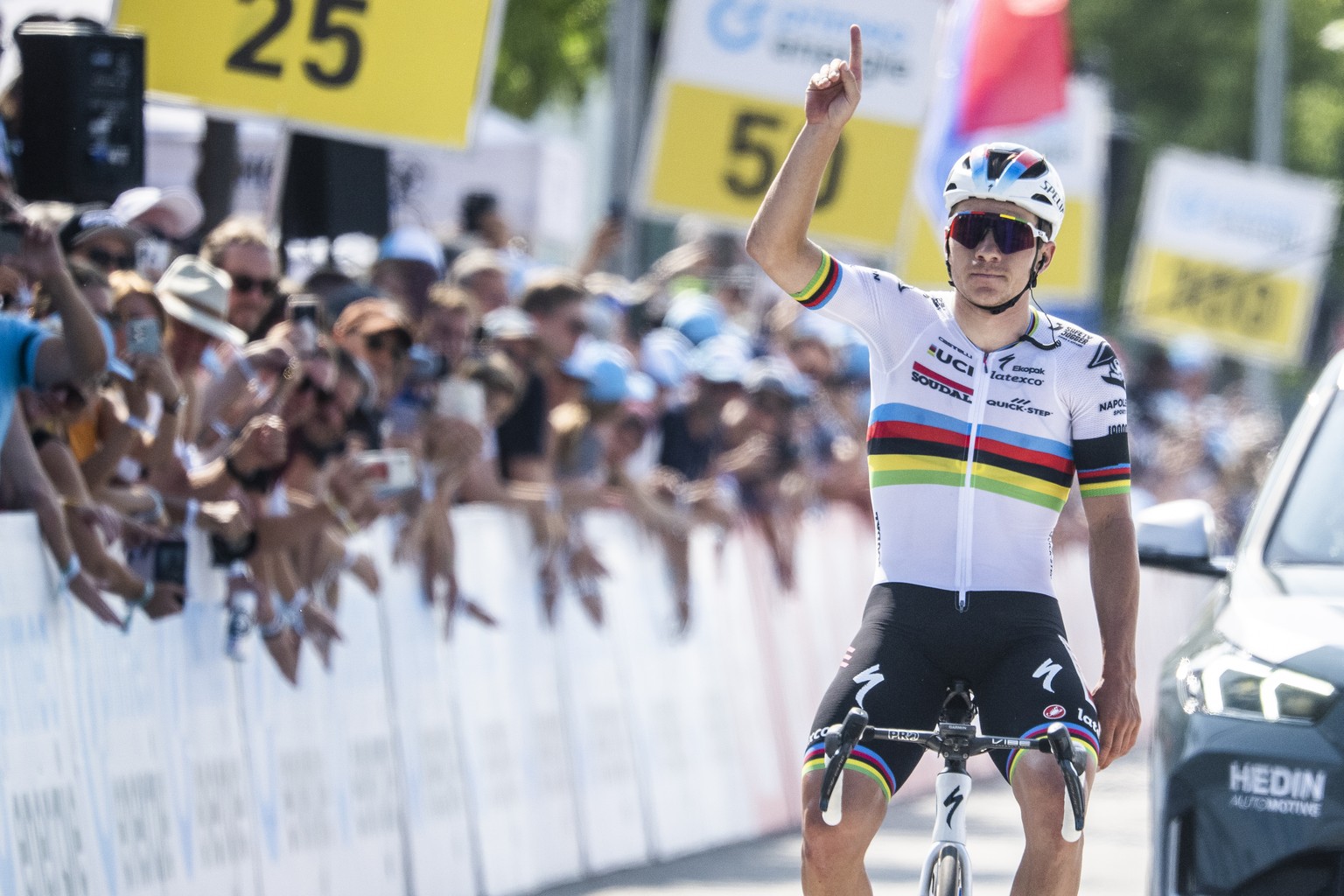 Remco Evenepoel from Belgium of Soudal-Quick Step celebrates after winning in commemoration of Gino Maeder of Switzerland who passed away yesterday after crashing, during the seventh stage, a 174 km r ...