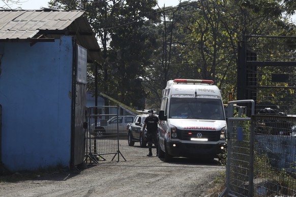 An ambulance leaves the Litoral Penitentiary after deadly clashes in Guayaquil, Ecuador, Tuesday, July 25, 2023. (AP Photo/Cesar Mu