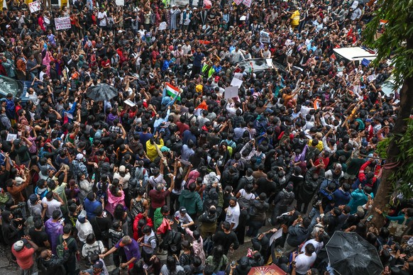 epa13126828 Supporters of the Cockroach Janta Party (CJP) hold placards and shout slogans as they gather for a protest march in Mumbai, India, 22 July 2026, demanding Union Education Minister Dharmend ...