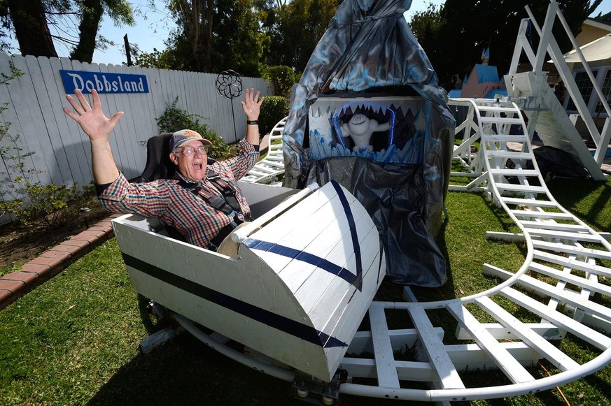 Steve Dobbs shows off his ride, The Madderhorn (cq) rollercoaster, in the backyard of his Fullerton home on June 1, 2016.Dobbs, a former Boeing aerospace engineer, built Disney-inspired rides in his ...