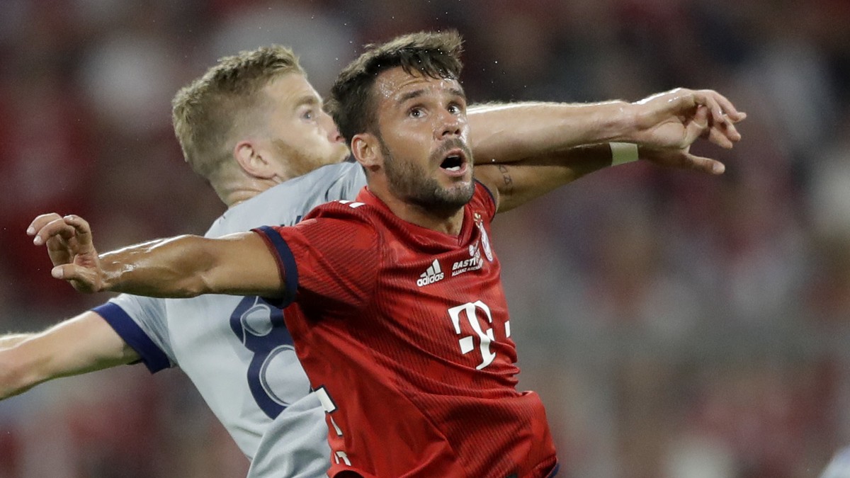 Chicago Fire's Michael DeLeeuw, background, and Bayern's Juan Bernat challenge for the ball during a farewell soccer match between FC Bayern Munich and Chicago Fire in Munich, Germany, Tuesd ...