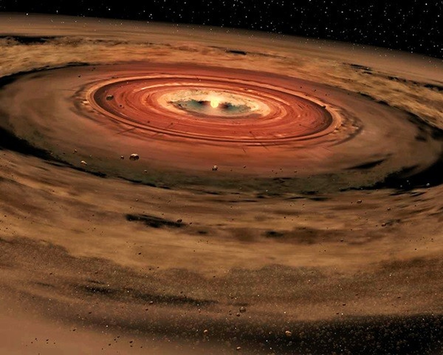 Protoplanetary disk: A disk of planet-forming dust swirls around a young star.
