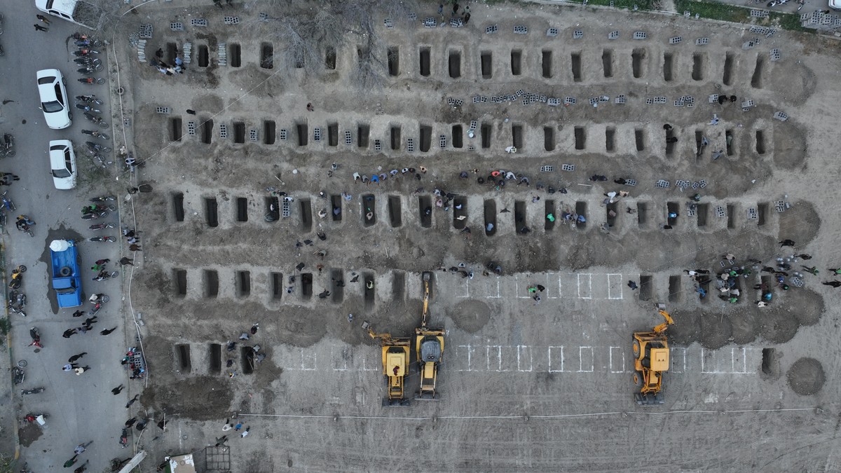 KEYPIX - epa12791539 A handout picture made available by the Iranian foreign press department shows graves being prepared for the victims of a Israel-US airstrike on a girls school in the city of Mina ...