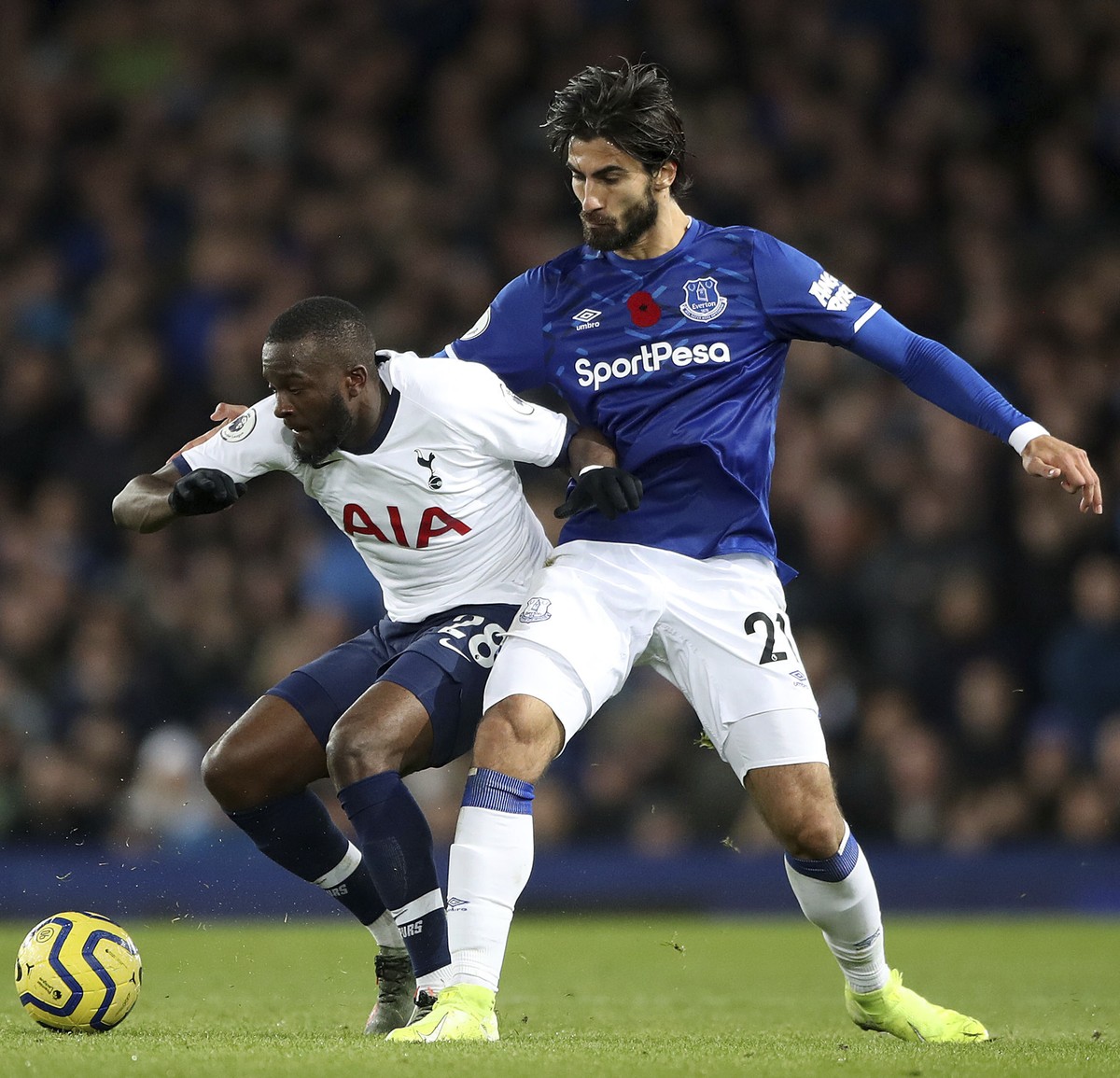 Tottenham Hotspur's Tanguy Ndombele, left, and Everton's Andre Gomes battle for the ball during the English Premier League soccer match at Goodison Park, Liverpool, England, Sunday Nov. 3, 2 ...