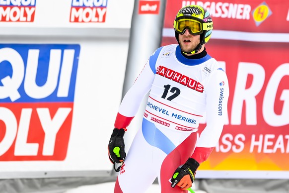 epa09830749 Justin Murisier of Switzerland reacts in the finish area during the men&#039;s Super-G race at the FIS Alpine Skiing World Cup finals in Courchevel, France, 17 March 2022. EPA/URS FLUEELER
