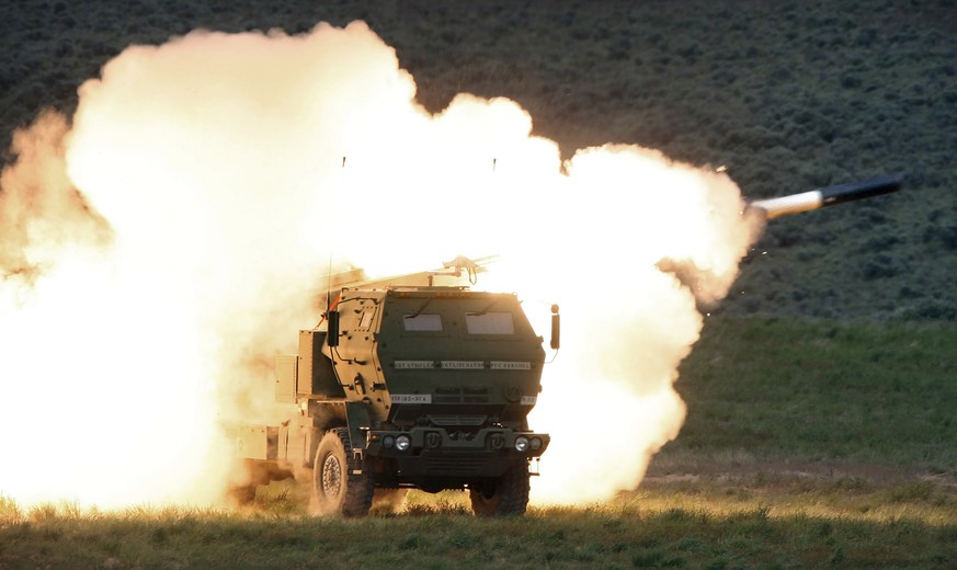 FILE - In this file photo taken May 23, 2011, a launch truck fires the High Mobility Artillery Rocket System (HIMARS) produced by Lockheed Martin during combat training in the high desert of the Yakim ...