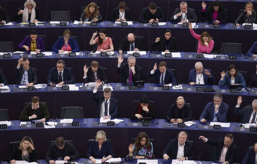 European Union lawmakers vote on an Artificial Intelligence Act at the European Parliament, Wednesday, March 13, 2024 in Strasbourg, eastern France. European Union lawmakers are set to give final appr ...
