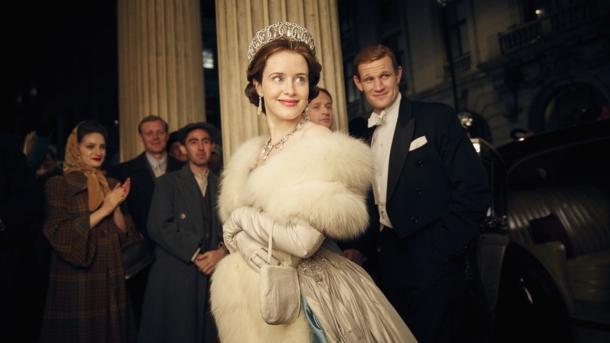 This image released by Netflix shows Claire Foy, center, and Matt Smith, right, in a scene from &quot;The Crown.&quot; The New York Times website recaps each episode of &quot;The Crown&quot; in text s ...