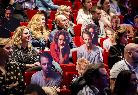 epa09026237 Visitors watch the performance of comedian Guido Weijers in Utrecht, The Netherlands, 20 February 2021. The event is part of a series of trial events in which Fieldlab is investigating how ...