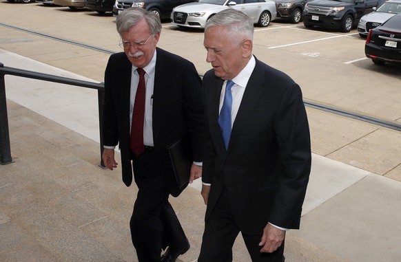 President Donald Trump&#039;s pick for national security adviser John Bolton, left, walks up the steps with Defense Secretary Jim Mattis, as Bolton arrives at the Pentagon, Thursday, March 29, 2018, i ...