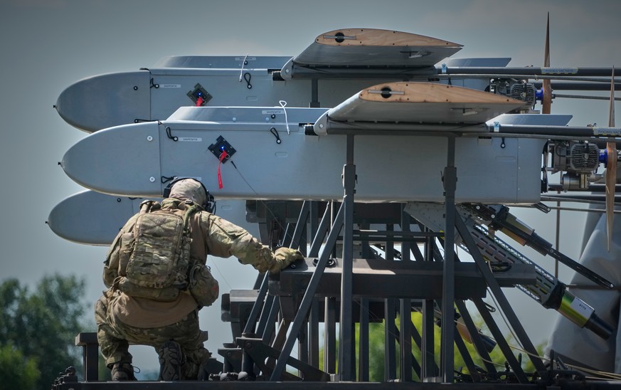 A soldier of Ukraine's 413th Separate Regiment of Unmanned Systems "Raid" prepares FP-1 long-range attack drones for a deep-strike drone mission to hit Russian targets deep in their ter ...
