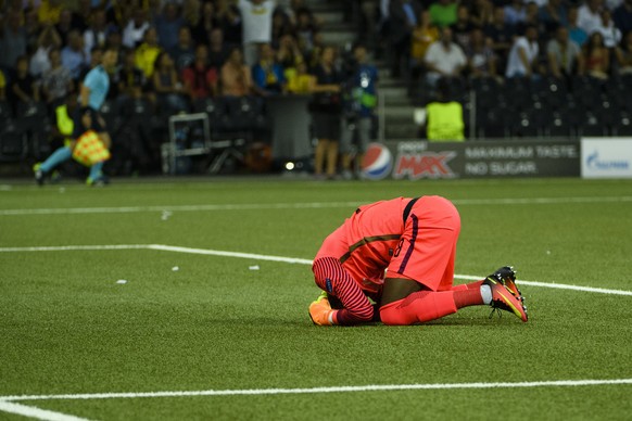 Young Boys&#039; Goalkeeper Yvon Mvogo reacts after a score from Moenchengladbach&#039;s Raffael (unseen), during an UEFA Champions League playoff first leg match between Switzerland&#039;s BSC Young  ...