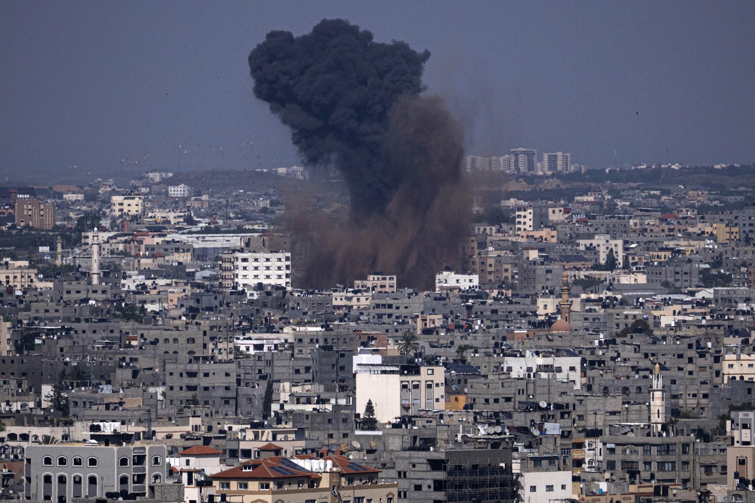Smoke rises from an Israeli airstrike in Gaza City, Wednesday, May 10, 2023. Palestinian militants fired dozens of rockets from the Gaza Strip into Israel on Wednesday, in a first response to Israeli  ...