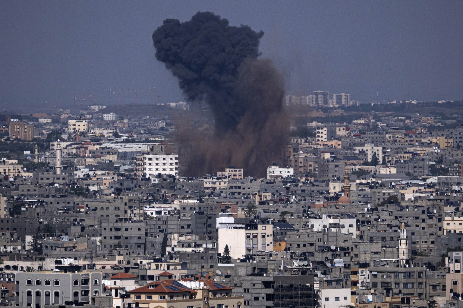 Smoke rises from an Israeli airstrike in Gaza City, Wednesday, May 10, 2023. Palestinian militants fired dozens of rockets from the Gaza Strip into Israel on Wednesday, in an initial response to Israeli…