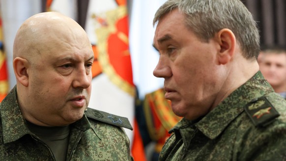 RUSSIA - DECEMBER 31, 2022: Army Gen Sergei Surovikin L, commander of the joint group of forces in the special military operation area, and Valery Gerasimov, Chief of the General Staff of the Russian  ...