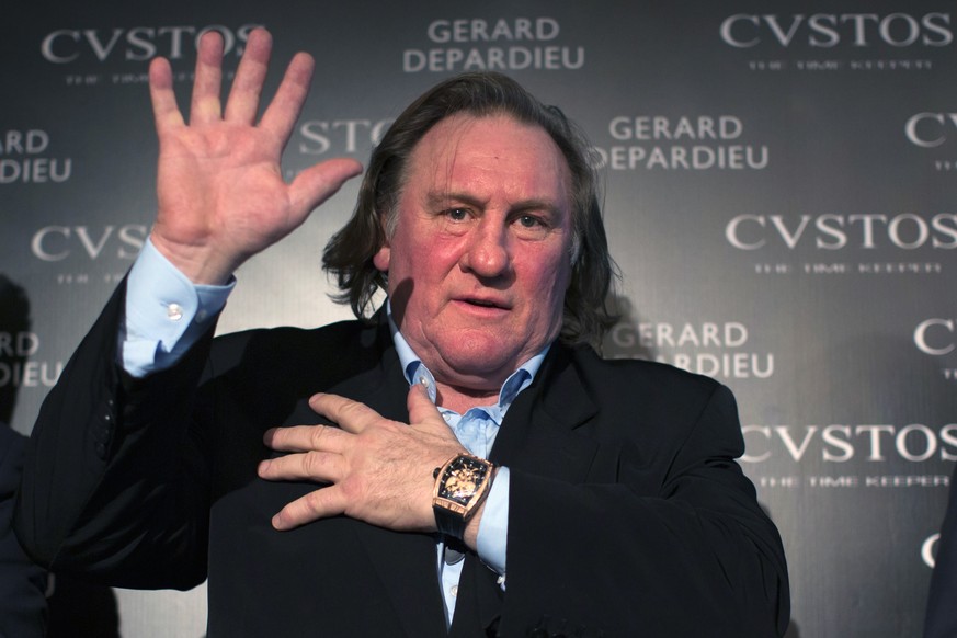 Actor Gerard Depardieu gestures during a presentation of watches by CVSTOS, a Swiss luxury watch brand from the line &quot;Proud to be Russian&quot; in Moscow, Russia, Wednesday, Dec. 17, 2014. (AP Ph ...