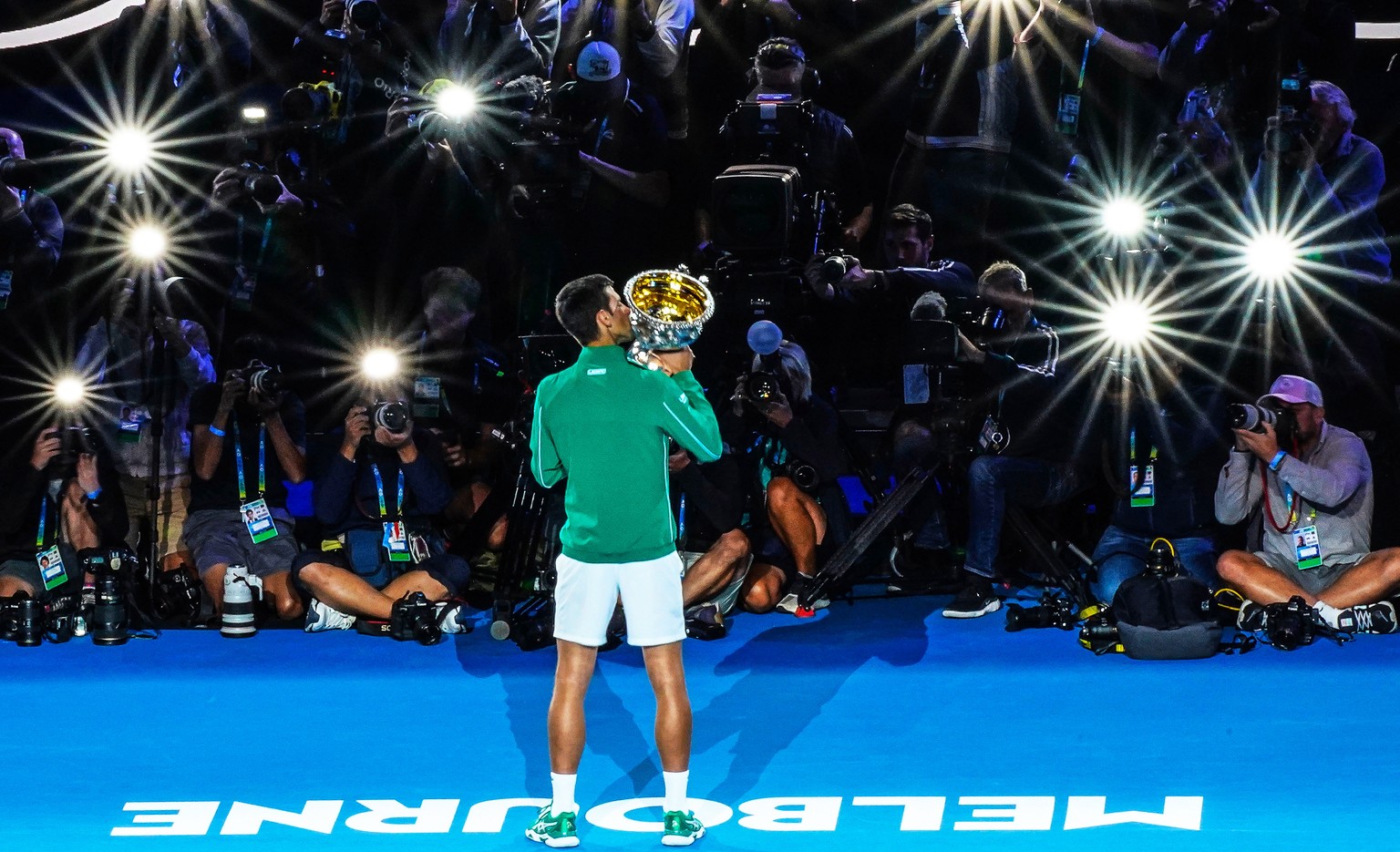 epa08187968 Novak Djokovic of Serbia kisses the Norman Brookes Challenge Cup trophy after winning the men&#039;s singles final against Dominic Thiem of Austria at the Australian Open Grand Slam tennis ...