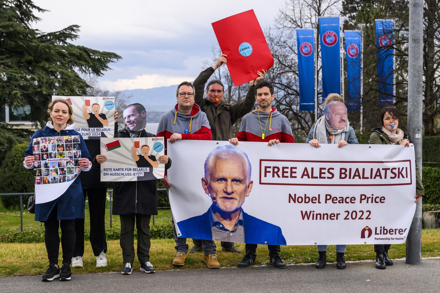 epa10540325 Human right activists protest to exclude Belarus from the next 2024 UEFA European Football Championship, in front of the UEFA headquarters in Nyon, Switzerland, 24 March 2023. UEFA has dec ...