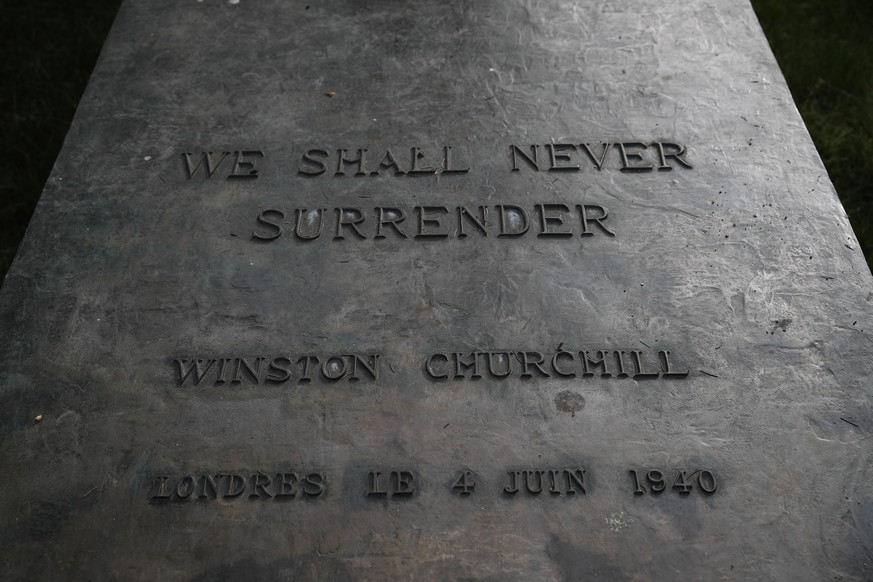 The basement of Britain&#039;s wartime Prime Minister Winston Churchill&#039;s statue is engraved with his famous sentence, Friday May 8, 2020 in Paris. The 75th anniversary of the end of World War II ...