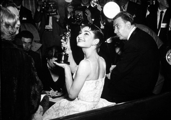 Audrey Hepburn is showing her best Actress academy award for Roman Holiday in 1954 1705810 Audrey Hepburn is showing her best Actress academy award for Roman Holiday in 1954 add.info.: Audrey Hepburn  ...