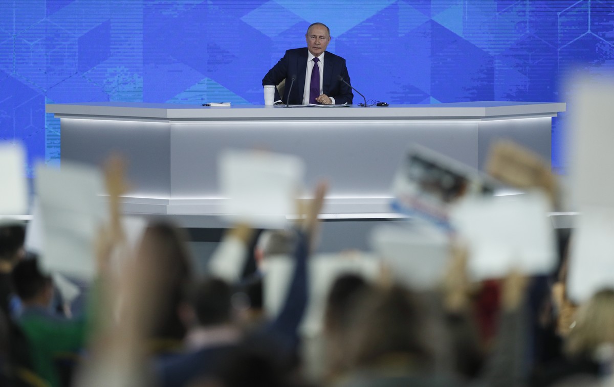 epa09654878 Russian President Vladimir Putin answers a question during his annual life-broadcast news conference with Russian federal, regional, and foreign media at the Moscow Manege in Moscow, Russi ...
