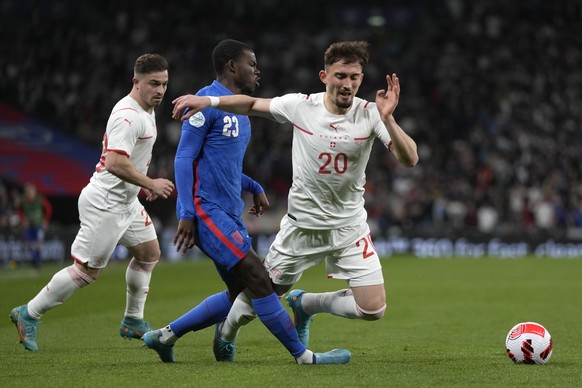 Switzerland&#039;s Andi Zeqiri, right, is challenged by England&#039;s Tyrick Mitchell during an international soccer match between England and Switzerland at Wembley Stadium in London, Saturday, Marc ...