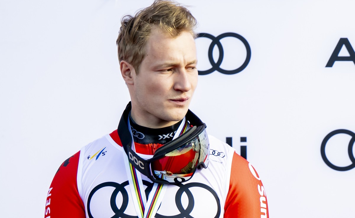 Second placed of the men's Giant-Slalom overall ranking Marco Odermatt of Switzerland, left, and Lucas Pinheiro Braathen of Brazil, right, celebrate during the podium ceremony at the Lillehammer  ...