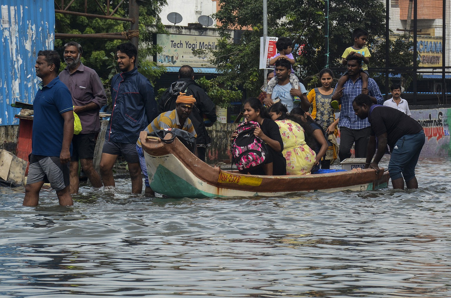 People are evacuated from flooded areas following heavy rains along the Bay of Bengal coast in Chennai, India, Tuesday, Dec.5, 2023. Tropical Storm Michaung began making landfall along India&#039;s so ...
