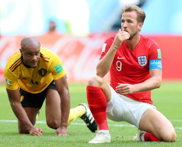 epa06888246 Harry Kane (R) of England reacts next to Vincent Kompany of Belgium during the FIFA World Cup 2018 third place soccer match between Belgium and England in St.Petersburg, Russia, 14 July 20 ...