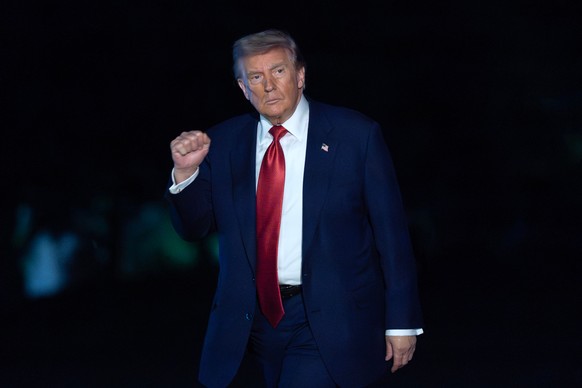 President Donald Trump waves to reporters as he walks on the South Lawn upon his arrival to the White House, Friday, May 8, 2026, in Washington. (AP Photo/Jose Luis Magana)
Donald Trump