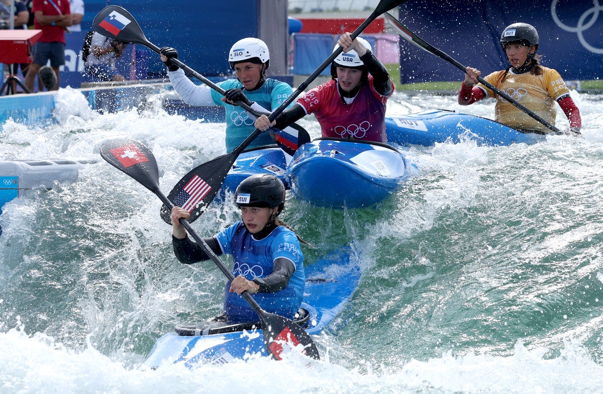 epa11525361 Eva Tercelj (L) of Slovenia, Evy Leibfarth of the USA, Alena Marx (front) of Switzerland and Viktoria Wolffhardt (R) of Austria at the start of their heat in the Women Kayak Cross of the C ...