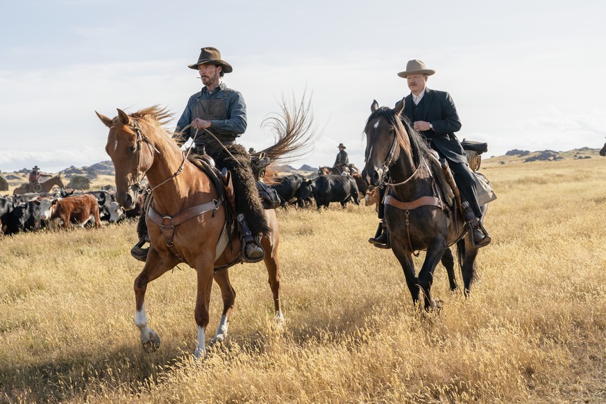 This image released by Netflix shows Benedict Cumberbatch, left, and Jesse Plemons in a scene from &quot;The Power of the Dog.&quot; The film will premiere at the 78th Venice International Film Festiv ...