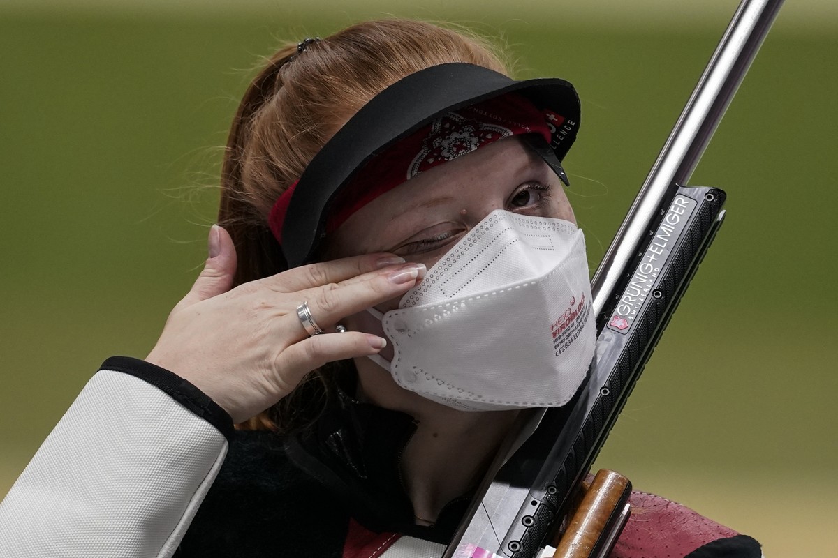 Nina Christen, of Switzerland, after the women's 50-meter 3 positions rifle at the Asaka Shooting Range in the 2020 Summer Olympics, Saturday, July 31, 2021, in Tokyo, Japan. Christen took the go ...