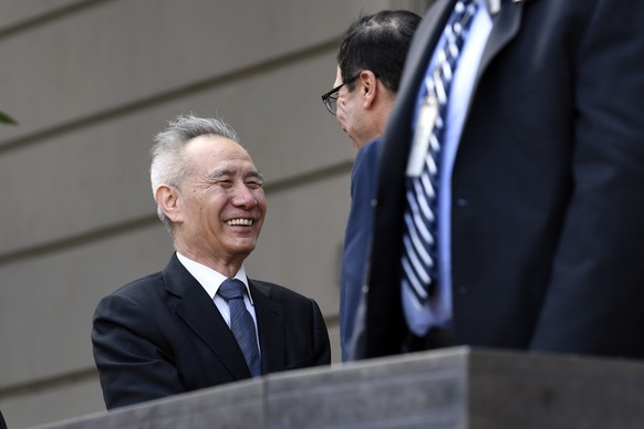 Treasury Secretary Steven Mnuchin, right, greets Chinese Vice Premier Liu He as he arrives for trade talks between the United States and China at the Office of the United States Trade Representative i ...