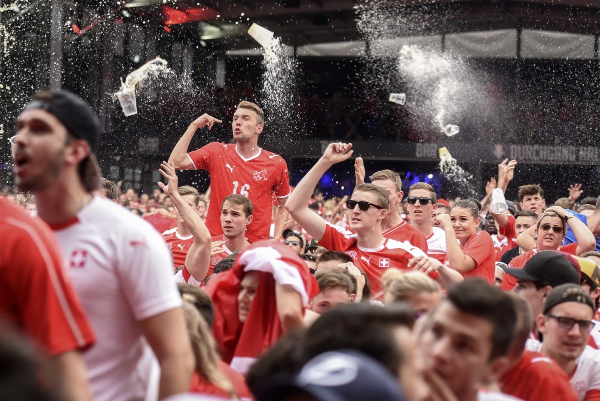 Swiss supporters react at a public viewing of the FIFA 2018 World Cup round of 16 soccer match between Switzerland and Sweden, in the fan zone "Winti Arena" in Winterthur, Switzerland, Tuesd ...