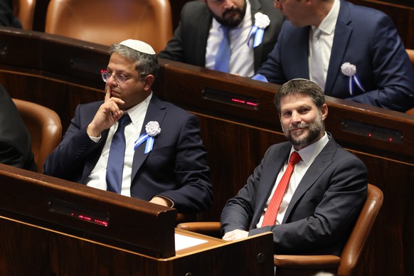 FILE - Israeli right-wing Knesset member Itamar Ben Gvir, left, and Bezalel Smotrich watch the swearing-in ceremony for Israeli lawmakers at the Knesset, Israel's parliament, in Jerusalem...
